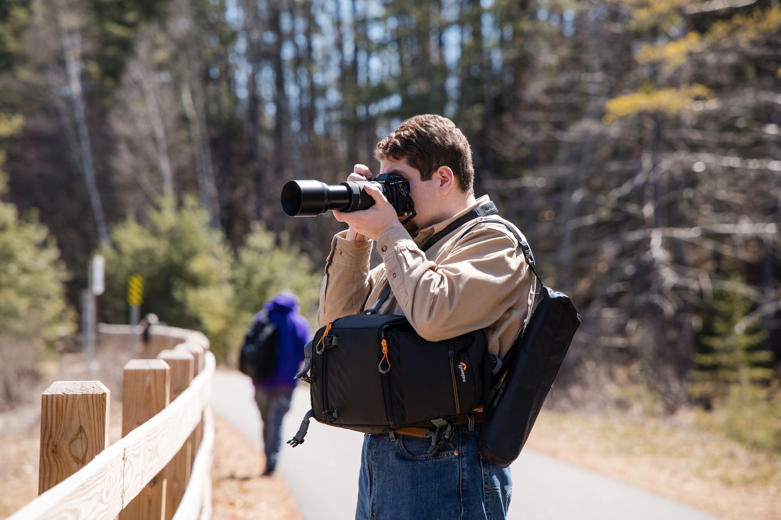 A student in our Digital Arts and Design program takes a photo on the rail trail