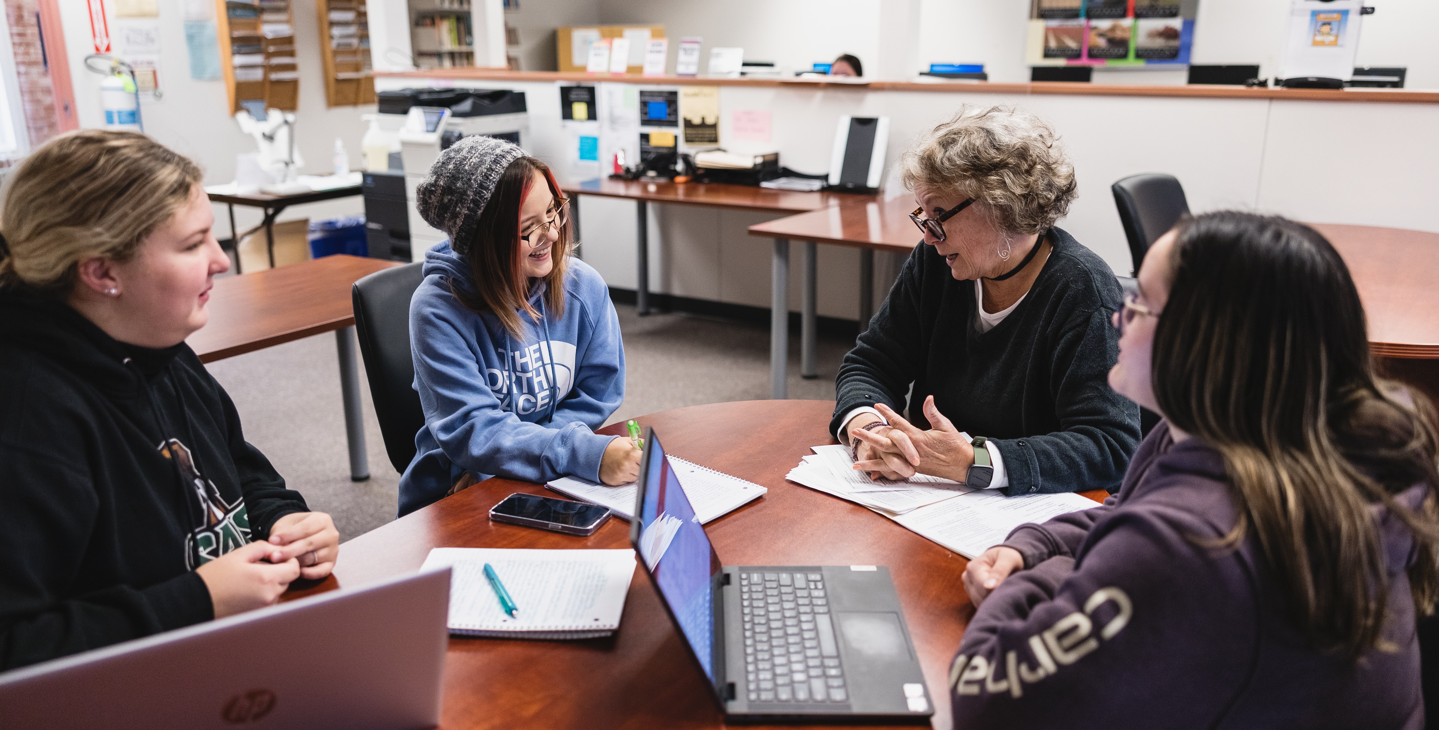 Students listen to an instructor in the college's Learning Assistance Center