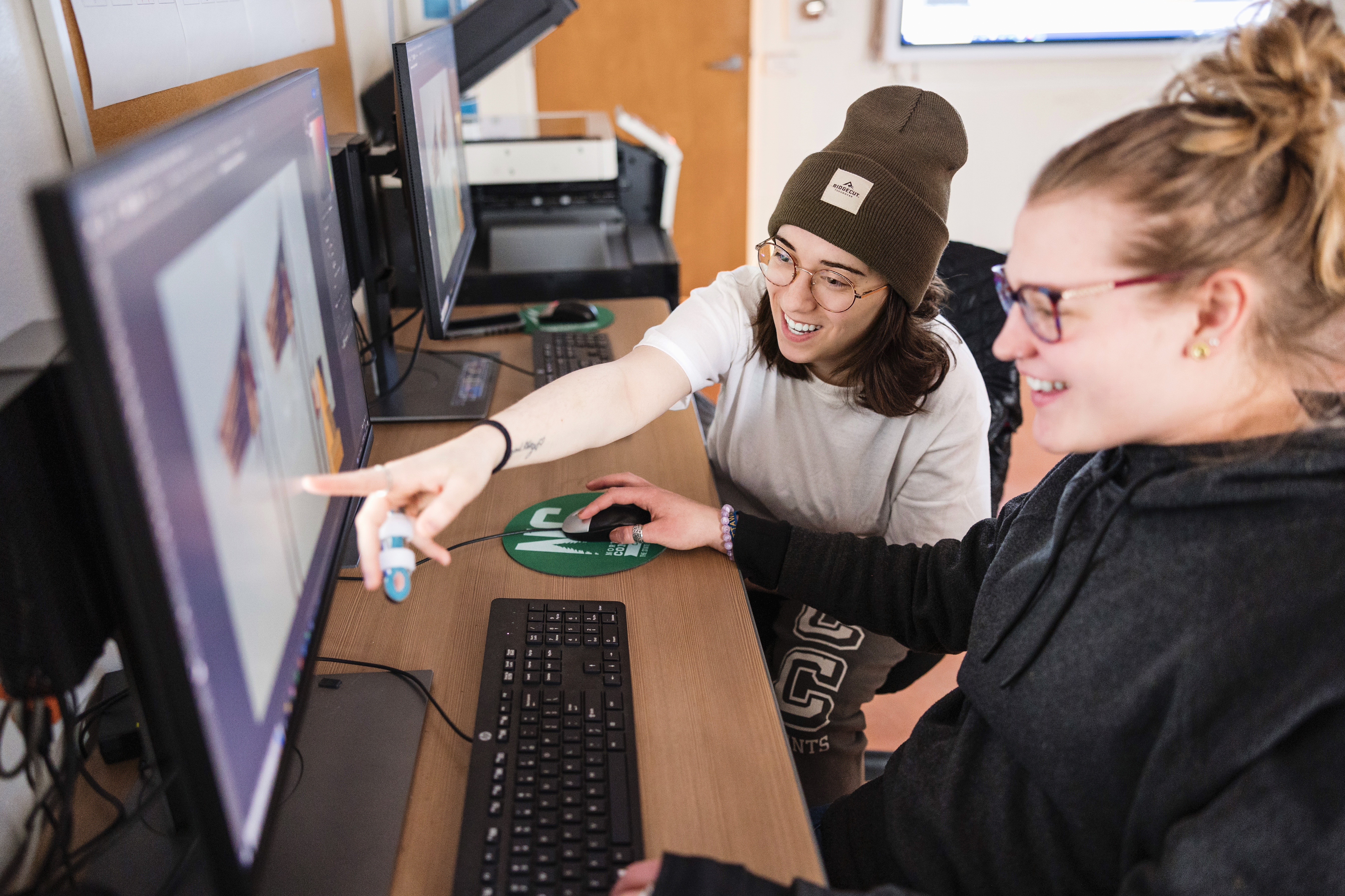 Students work at a computer