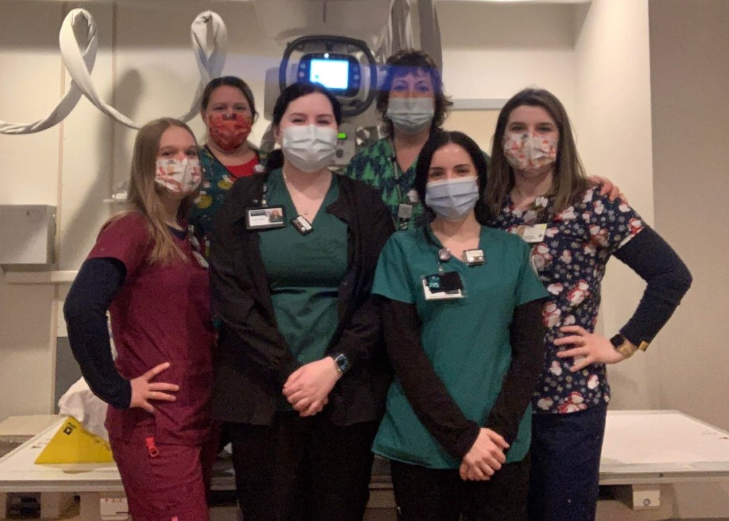 Sophmore Rad Tech students Jenna Tashjian and Darian Rowe (green scrubs) stand with staff at Alice Hyde Medical Center in Malone.
