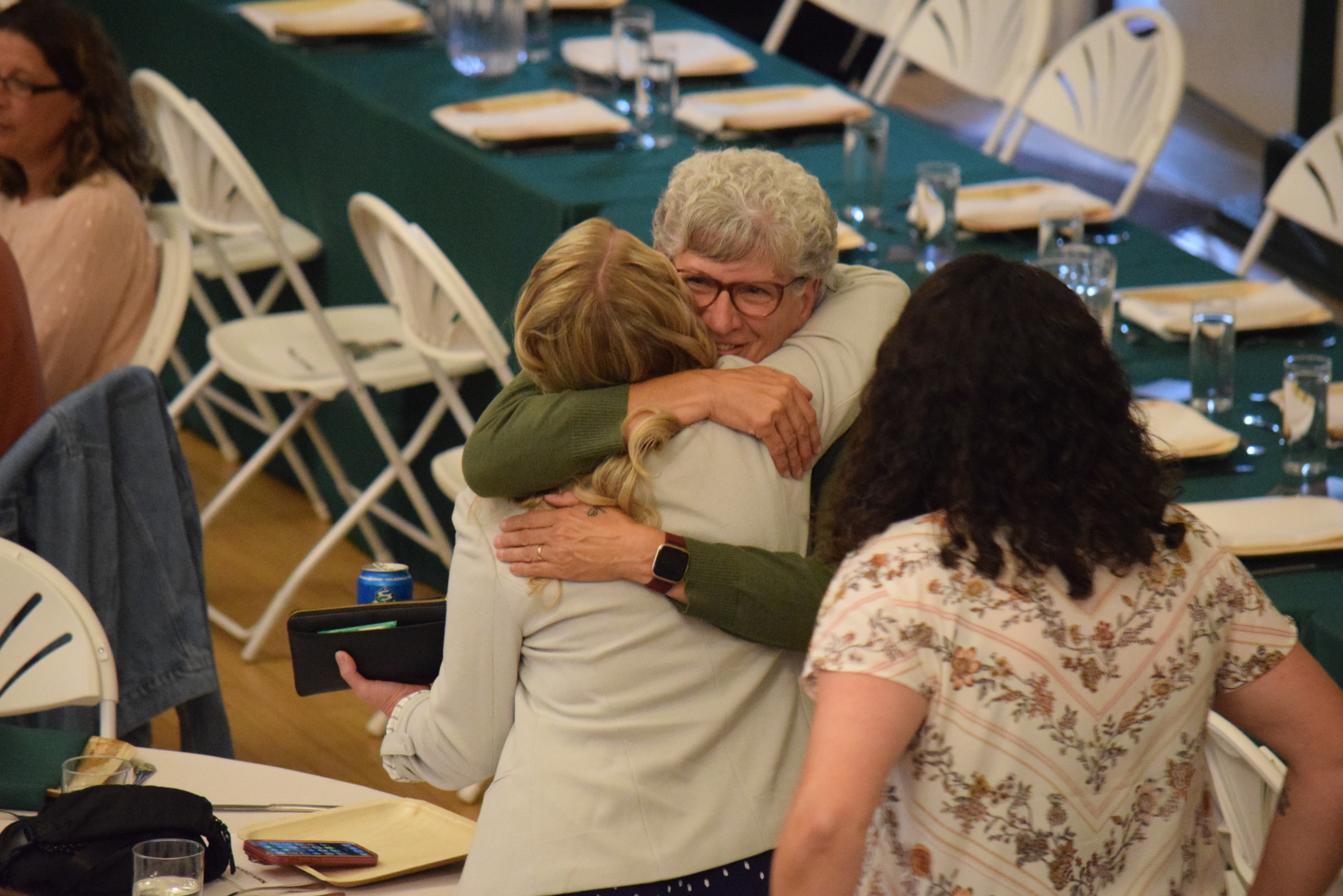 Alumni of the college's athletic program meet during the college's Hall of Fame induction ceremony