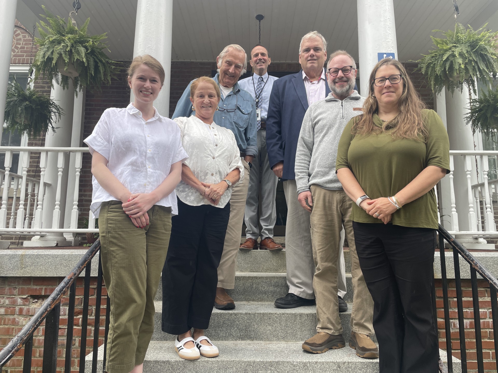 New North Country Community College Trustees Jessica Kemp and Jordanna Mallach, front row from left, stand in front of Hodson Hall on the Saranac Lake campus with fellow college trustees, second row from left, Tricia Preston and Seth McGowan; third row from left, board Chair Pete Suttmeier and Trustee David McNally; and college President Joe Keegan. Not pictured are Trustees Todd LaPage, Linda Beers and Donna Wadsworth.