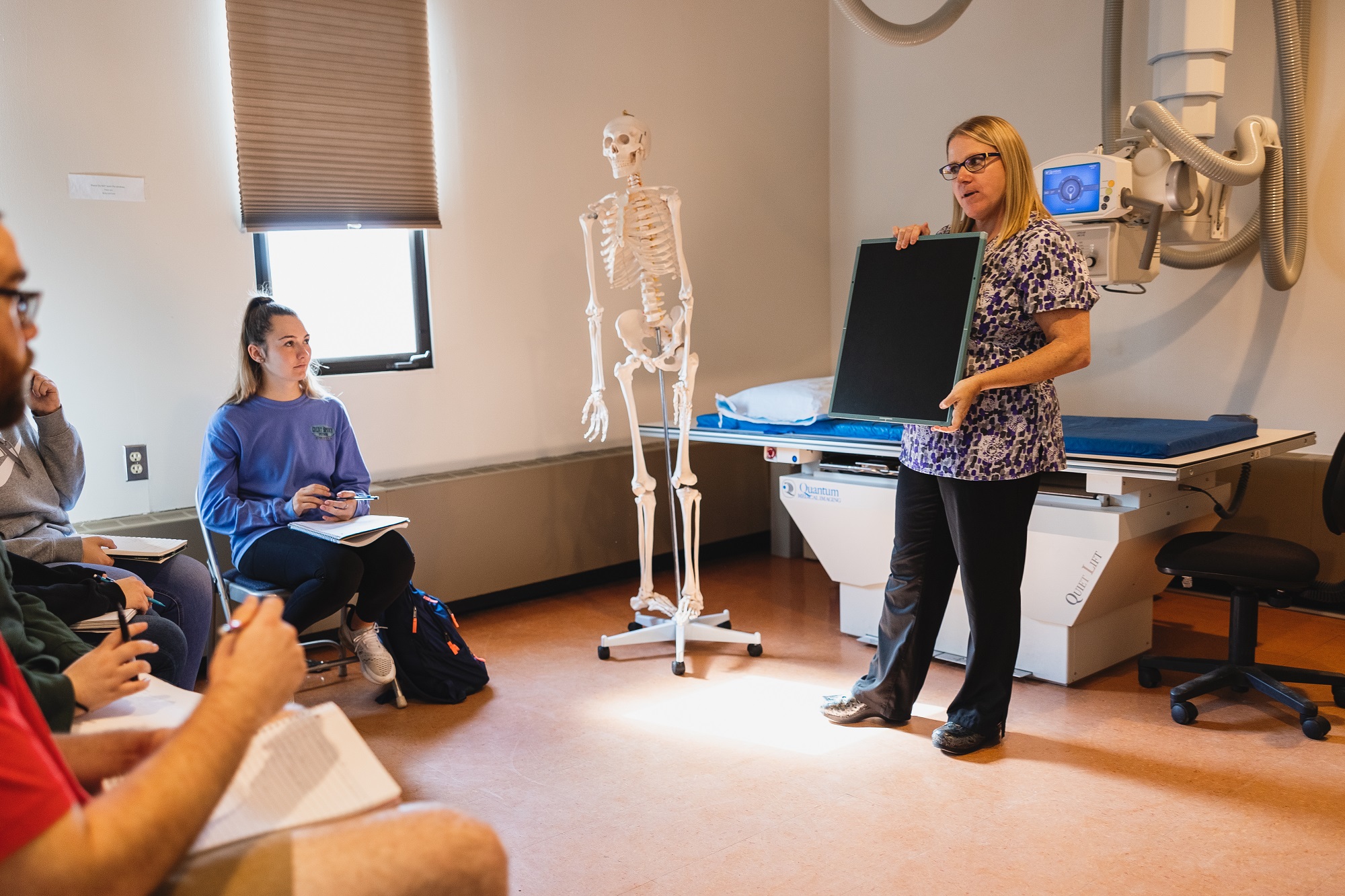 Becky LaDue, director of North Country Community College's Radiologic Technology program, instructs students in the college's radiology lab on the Saranac Lake campus