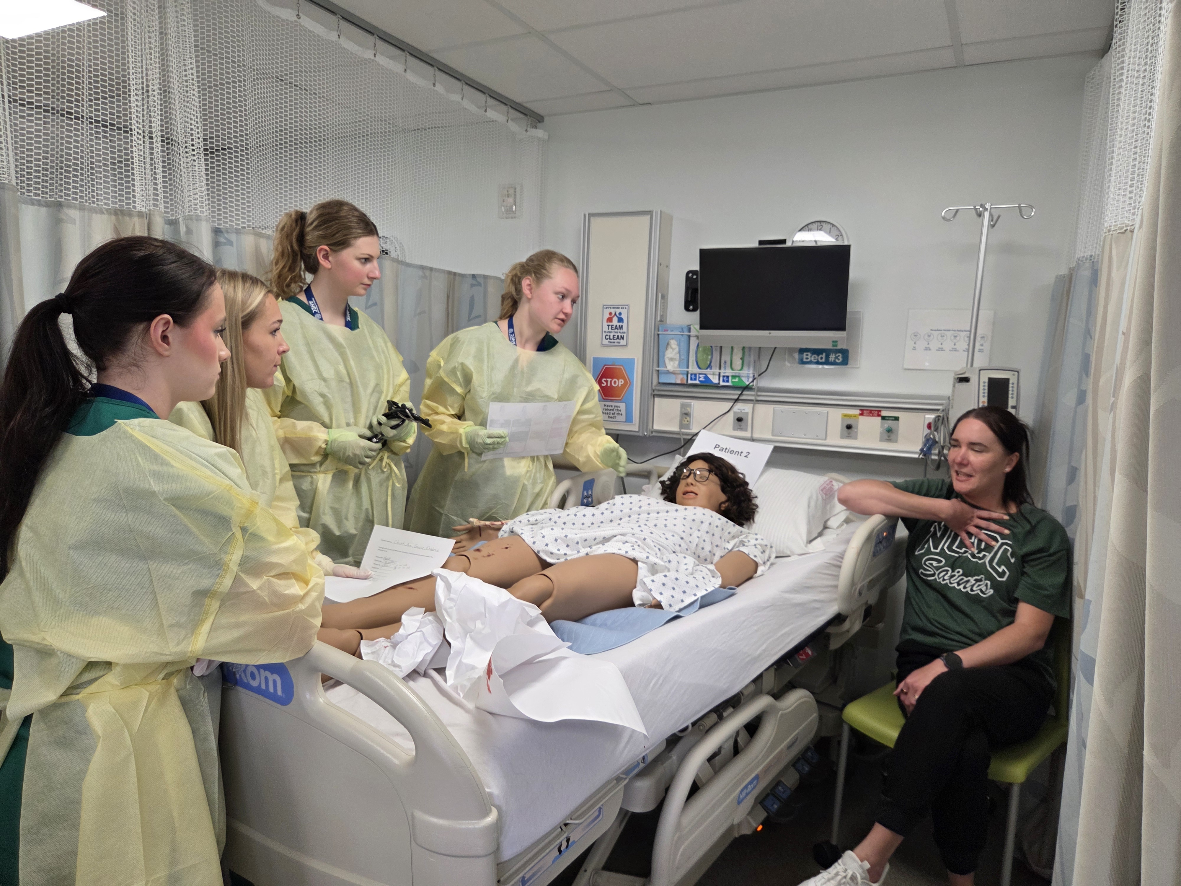 Students conduct a patient assessment during the Ticonderoga MASH Camp