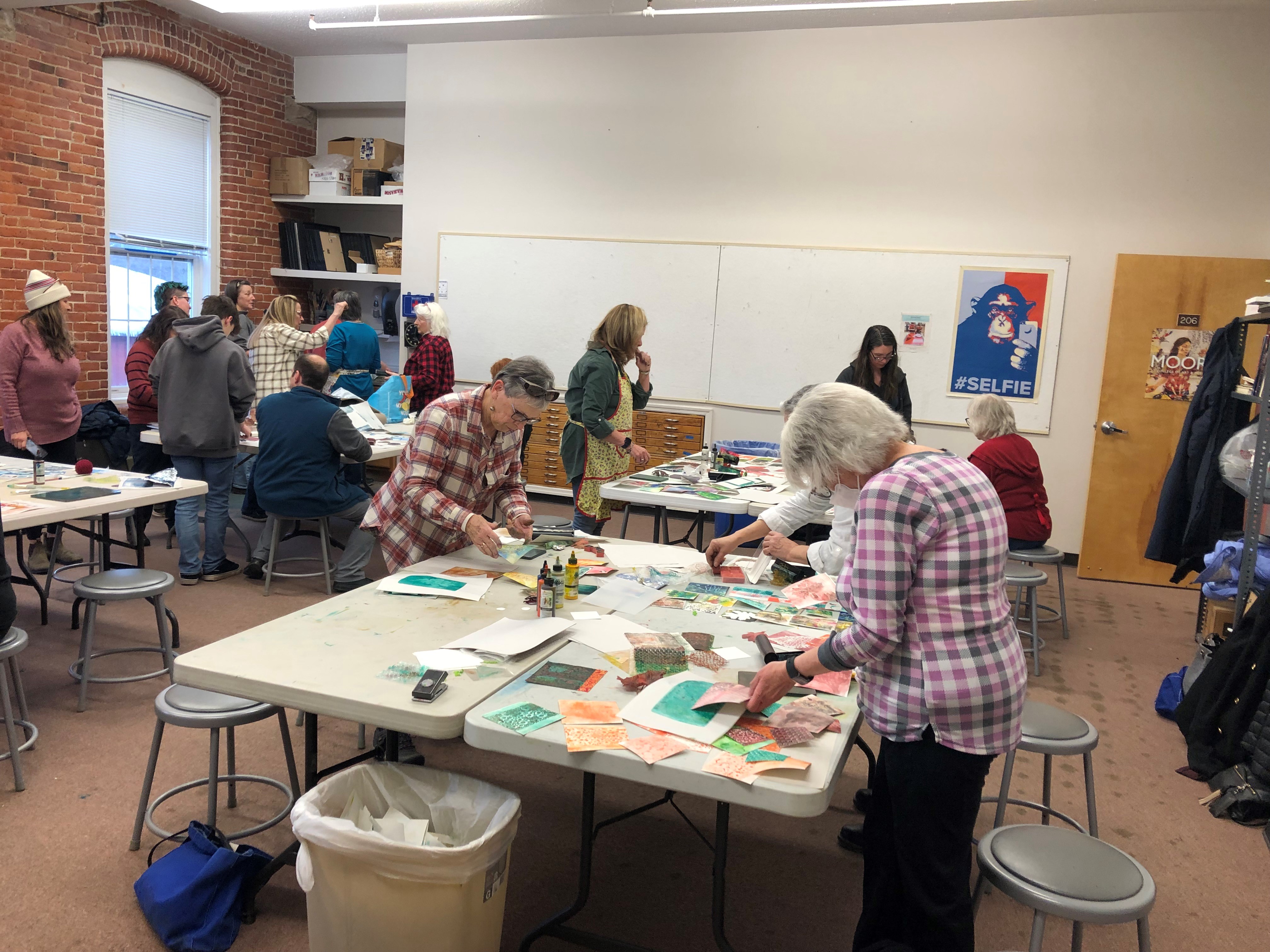 Artists work on prints at the college's Malone campus