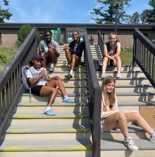 North Country Community College students take a break during the first day of classes Monday on the steps of the college’s Saranac Lake campus library.