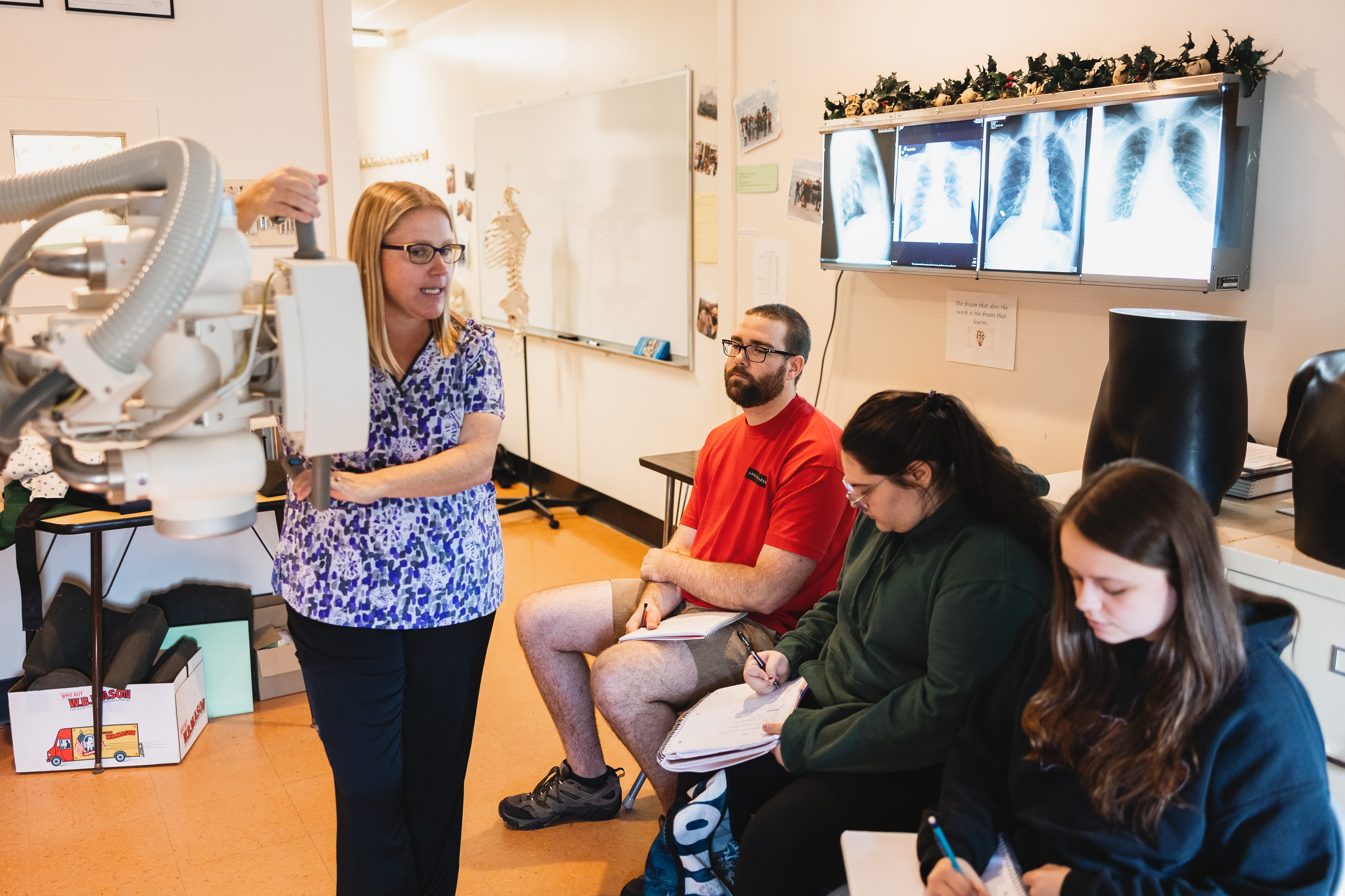 Students take notes during a Radiologic Technology class